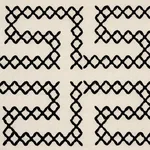 Schumacher 70230 A Maze Embroidery Black On Ivory fabric swatch