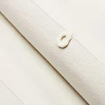 Schumacher 81382 Globo Knotted Handwoven White fabric swatch