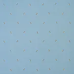 Schumacher 78421 Honey Bee Embroidery Sky fabric swatch