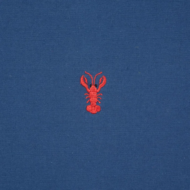 Schumacher 78800 Lobster Embroidery Navy fabric swatch
