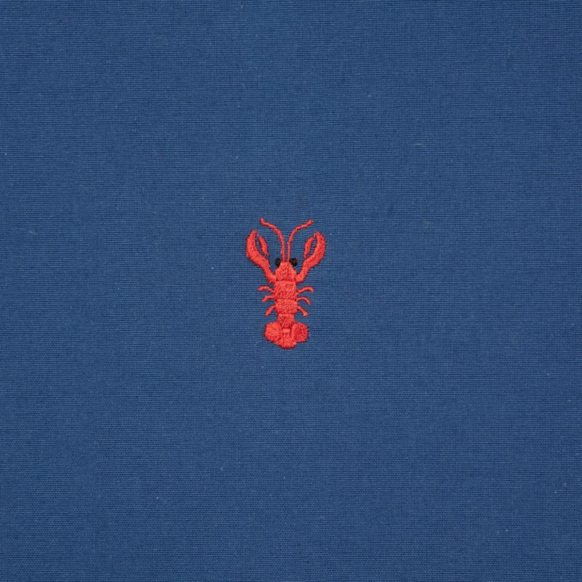 Schumacher 78800 Lobster Embroidery Navy fabric swatch