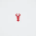 Schumacher 78801 Lobster Embroidery White fabric swatch