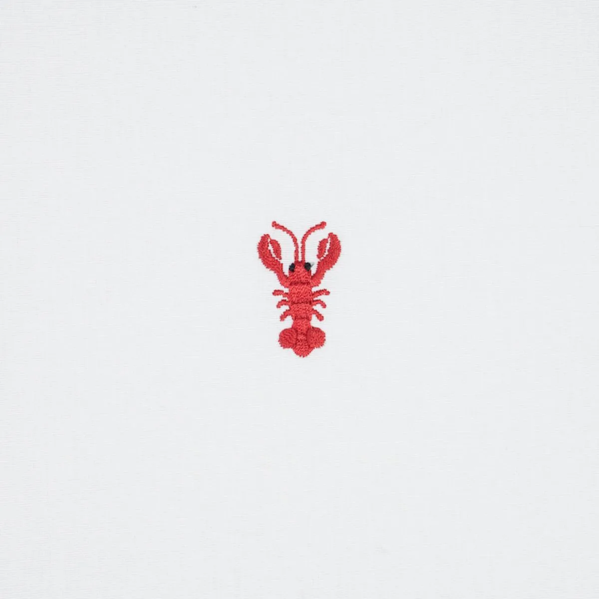 Schumacher 78801 Lobster Embroidery White fabric swatch