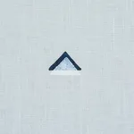 Schumacher 74022 Overlapping Triangles Hand Print Navy And White On Sky fabric swatch