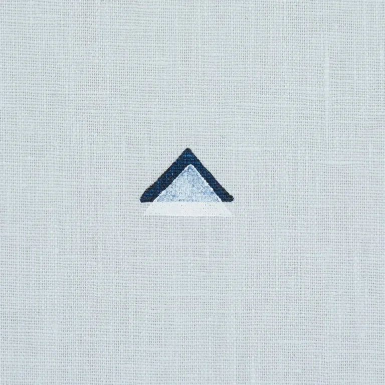 Schumacher 74022 Overlapping Triangles Hand Print Navy And White On Sky fabric swatch