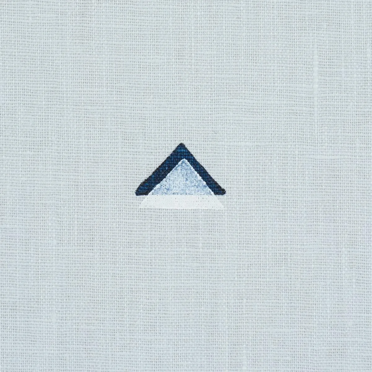 Schumacher 74022 Overlapping Triangles Hand Print Navy And White On Sky fabric swatch