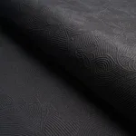 Schumacher 81591 Quilted Scroll Matelassé Pitch Black fabric swatch