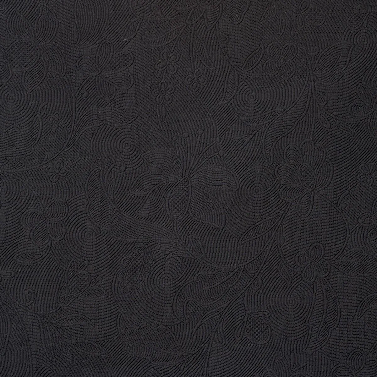 Schumacher 81591 Quilted Scroll Matelassé Pitch Black fabric swatch