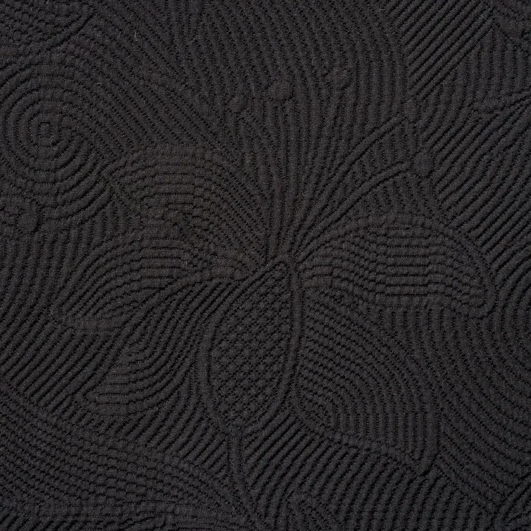 Schumacher 81591 Quilted Scroll Matelassé Pitch Black fabric swatch