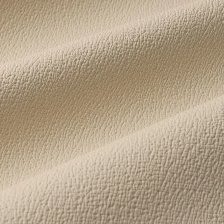 Schumacher 87301 Textured Vegan Leather Cream fabric swatch