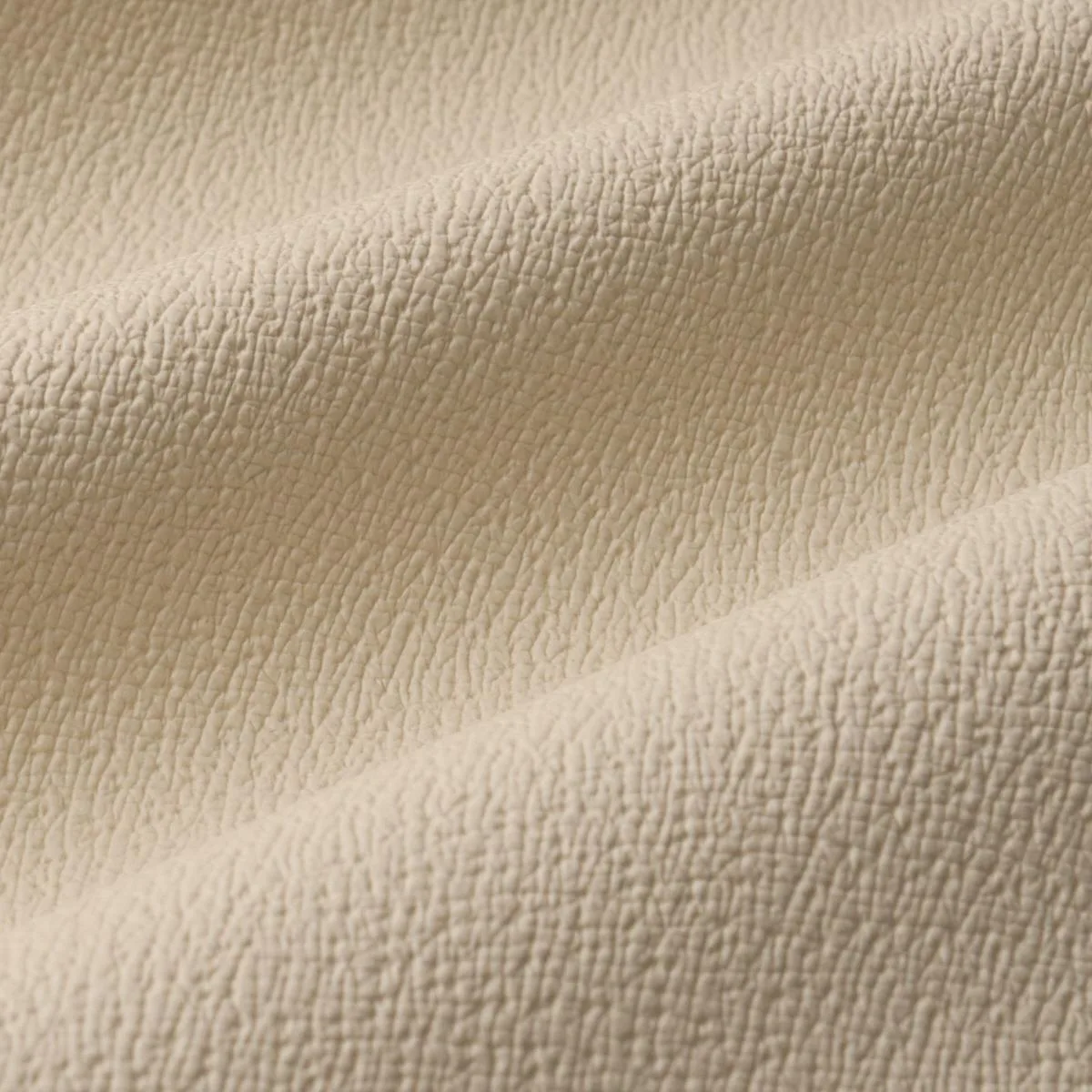 Schumacher 87301 Textured Vegan Leather Cream fabric swatch