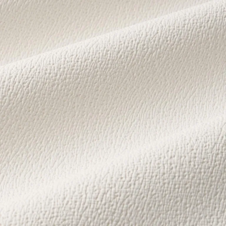 Schumacher 87300 Textured Vegan Leather Ivory fabric swatch