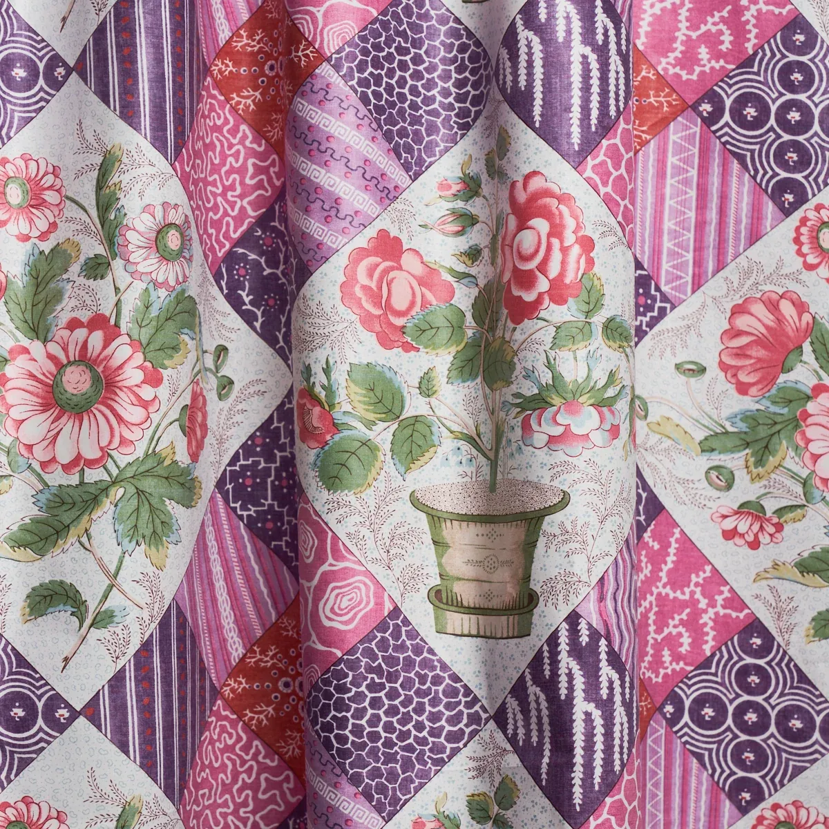 CALDWELL PATCHWORK CHINTZ fabric FUCHSIA AND PLUM color by Schumacher