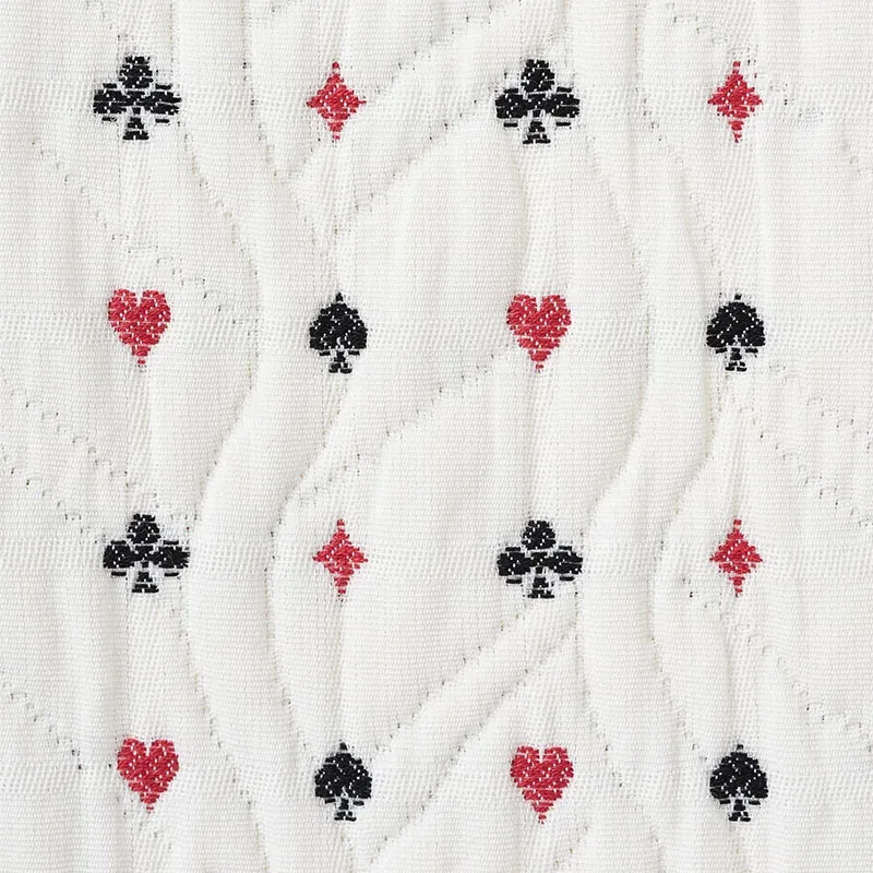 LE JOUEUR MATELASSÉ Fabric – ROUGE ET NOIR | Schumacher | Wa LE JOUEUR MATELASSÉ fabric ROUGE ET NOIR color by Schumacher
