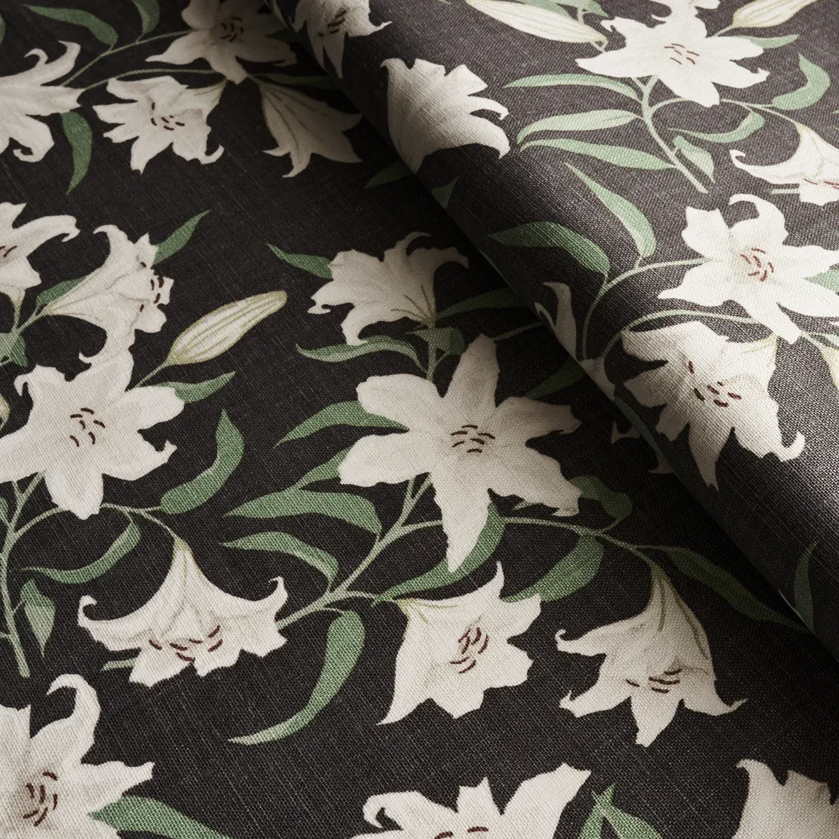 SCATTERED LILIES Fabric – CHARCOAL | Schumacher | Wallpaper SCATTERED LILIES fabric CHARCOAL color by Schumacher