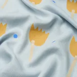 TULIP PLAY HAND BLOCK PRINT Fabric – OCHRE ON SKY | Schumach TULIP PLAY HAND BLOCK PRINT fabric OCHRE ON SKY color by Schumacher