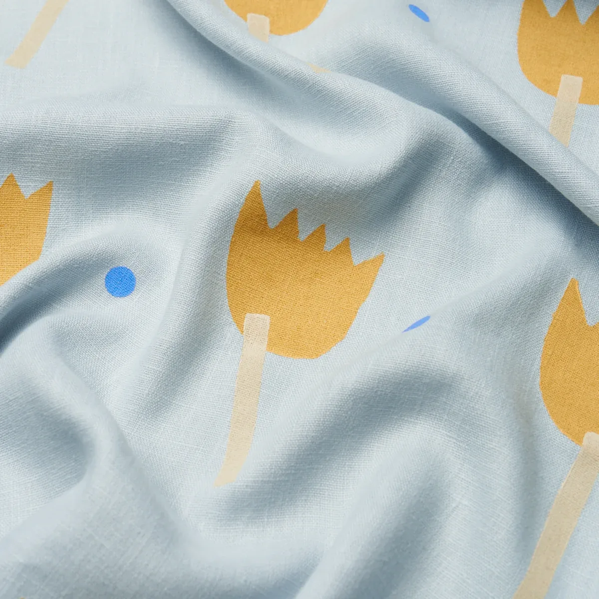 TULIP PLAY HAND BLOCK PRINT Fabric – OCHRE ON SKY | Schumach TULIP PLAY HAND BLOCK PRINT fabric OCHRE ON SKY color by Schumacher