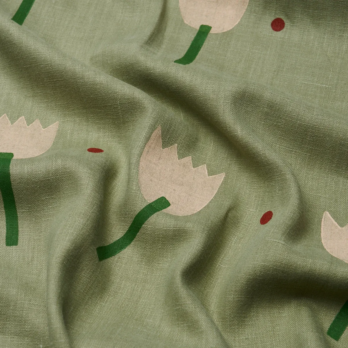 TULIP PLAY HAND BLOCK PRINT fabric PEACH ON SAGE color by Schumacher