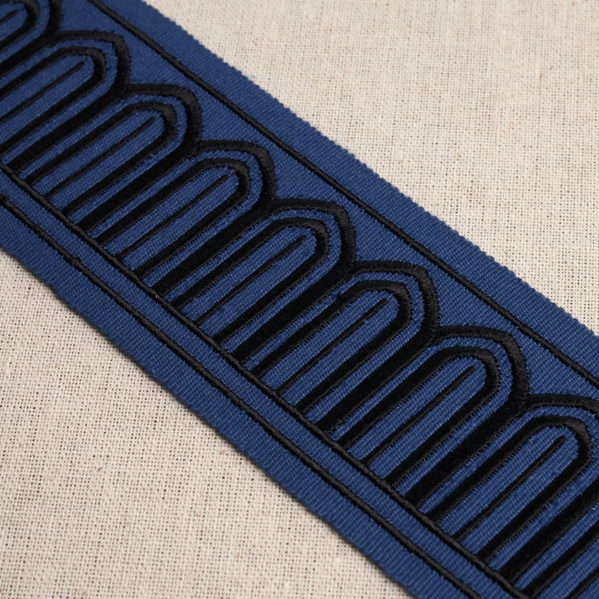 81150 | Arches Embroidered Tape Medium - Black on Navy Schumacher Arches Embroidered Tape Medium trim in Black on Navy (81150)