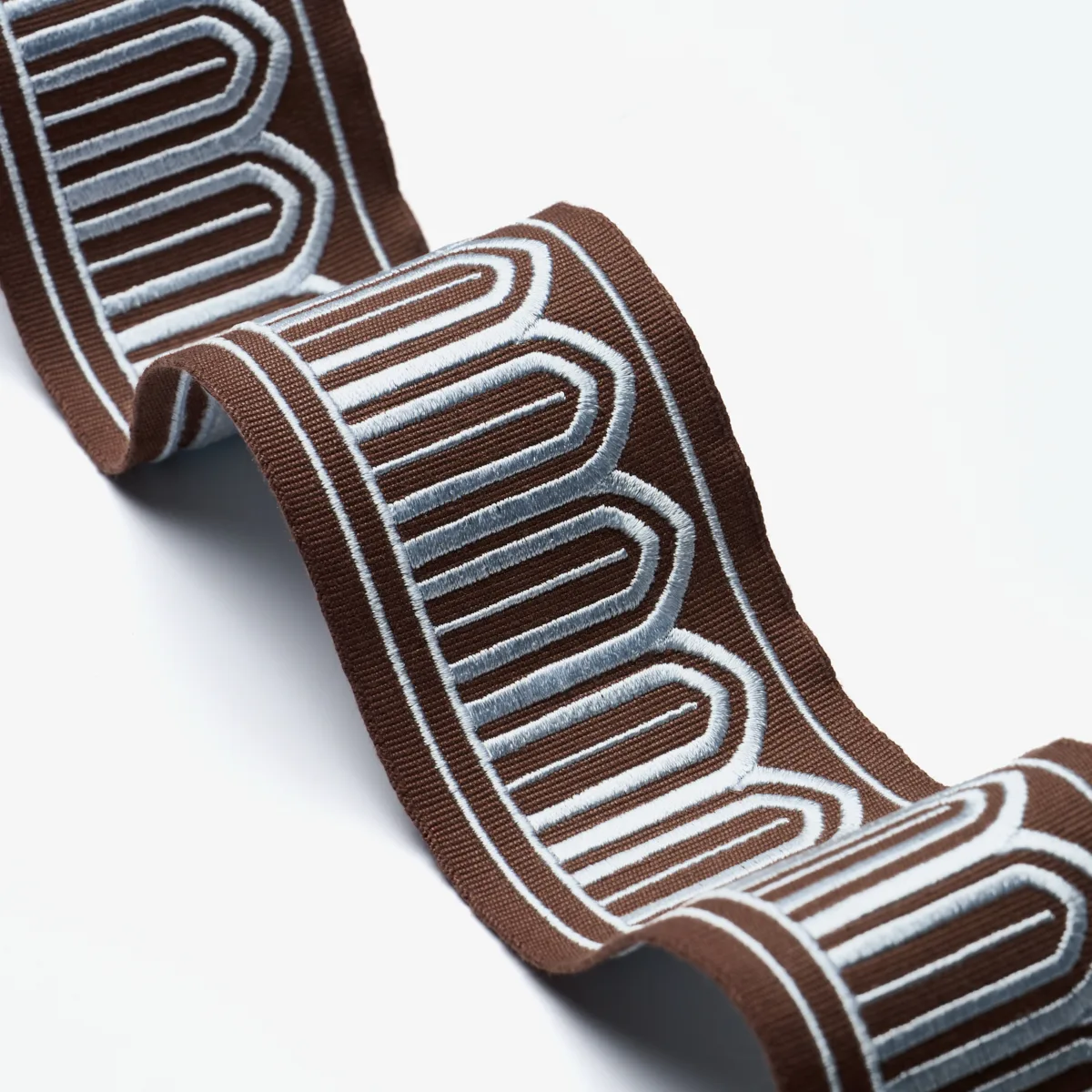 81153 | Arches Embroidered Tape Medium - Sky on Brown Schumacher Arches Embroidered Tape Medium trim in Sky on Brown (81153)