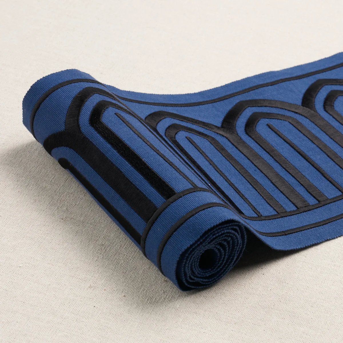 81160 | Arches Embroidered Tape Wide - Black on Navy Schumacher Arches Embroidered Tape Wide trim in Black on Navy (81160)
