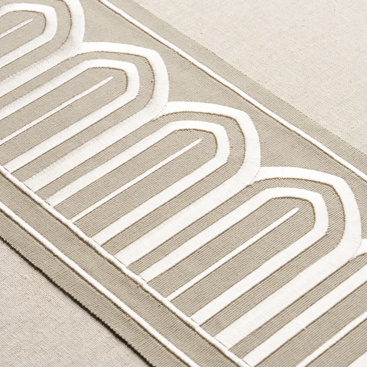 70776 | Arches Embroidered Tape Wide - Taupe Schumacher Arches Embroidered Tape Wide trim in Taupe (70776)