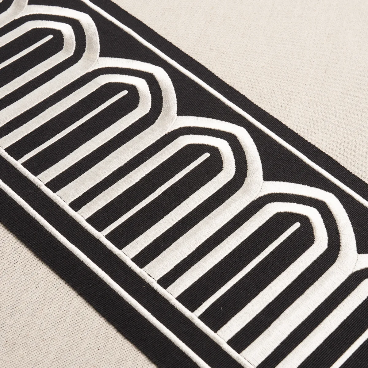 70777 | Arches Embroidered Tape Wide - White on Black Schumacher Arches Embroidered Tape Wide trim in White on Black (70777)