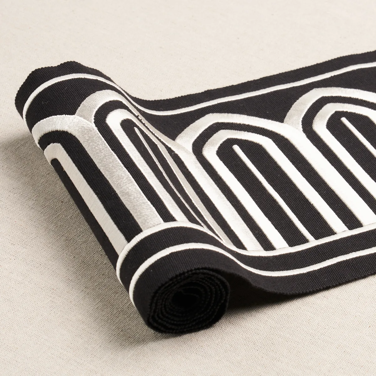 70777 | Arches Embroidered Tape Wide - White on Black Schumacher Arches Embroidered Tape Wide trim in White on Black (70777)