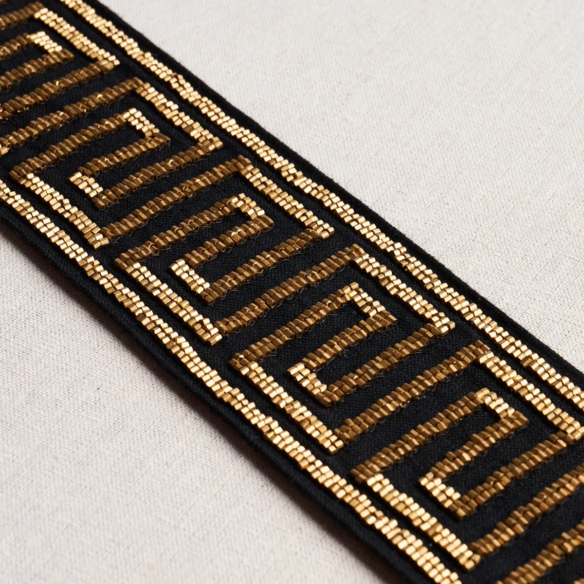 83642 | Delphi Beaded Tape - Gold on Black Schumacher Delphi Beaded Tape trim in Gold on Black (83642)