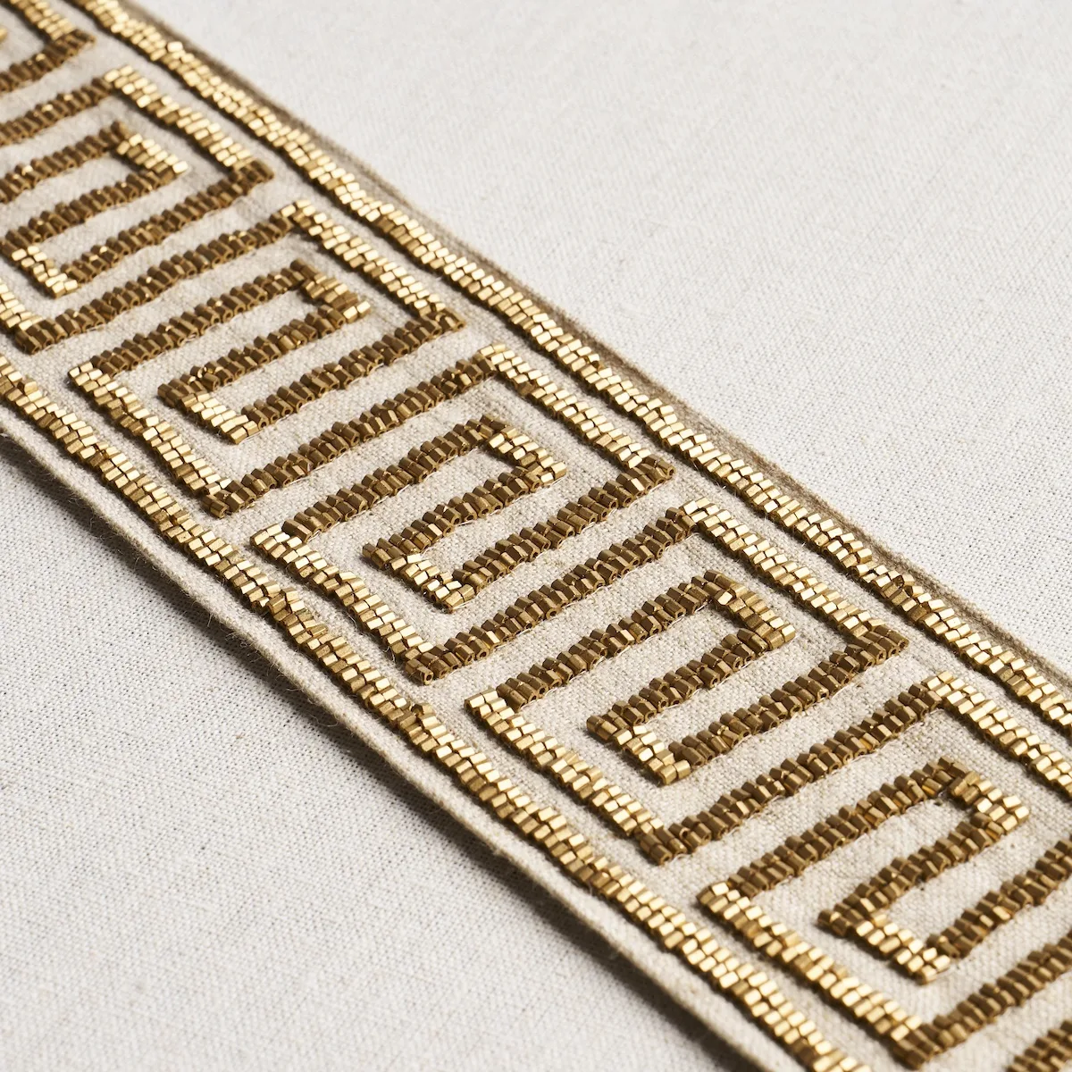 Schumacher Delphi Beaded Tape trim in Gold on Natural (83641)
