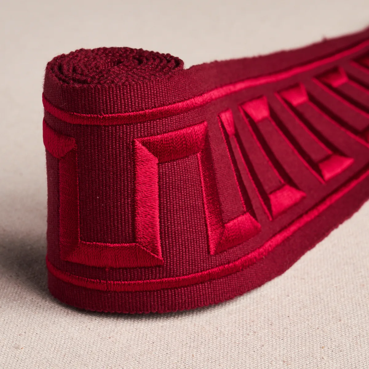 70805 | Greek Key Embroidered Tape - Burgundy Schumacher Greek Key Embroidered Tape trim in Burgundy (70805)