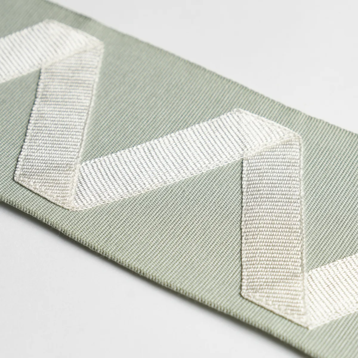 80872 | Legere Appliqué Tape - Ivory on Seaglass Schumacher Legere Appliqué Tape trim in Ivory on Seaglass (80872)