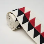 87582 | Quilted Diamond Tape - Black & Red Schumacher Quilted Diamond Tape trim in Black & Red (87582)