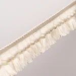 85680 | Rosalind Tassel Trim - Ivory Schumacher Rosalind Tassel Trim in Ivory (85680)