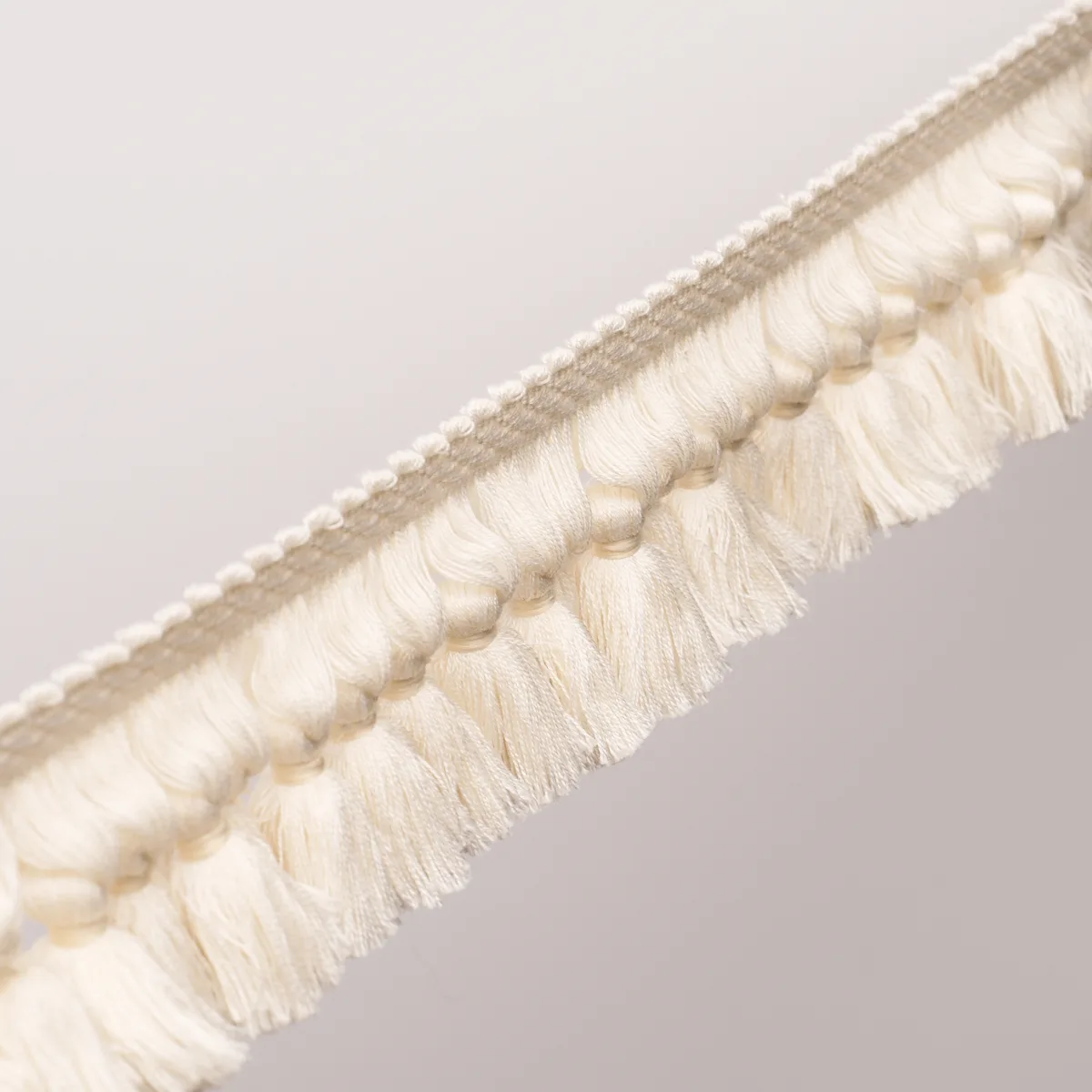 85680 | Rosalind Tassel Trim - Ivory Schumacher Rosalind Tassel Trim in Ivory (85680)