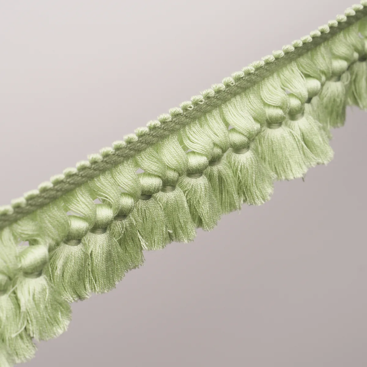 85683 | Rosalind Tassel Trim - Leaf Schumacher Rosalind Tassel Trim in Leaf (85683)