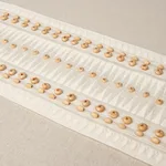 69312 | Tahiti Tape - Ivory Schumacher Tahiti Tape trim in Ivory (69312)