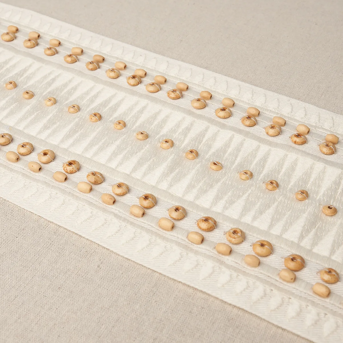 69312 | Tahiti Tape - Ivory Schumacher Tahiti Tape trim in Ivory (69312)