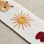 81680 | Tiny Things Embroidered Tape - Multi on Ivory Schumacher Tiny Things Embroidered Tape trim in Multi on Ivory (81680)