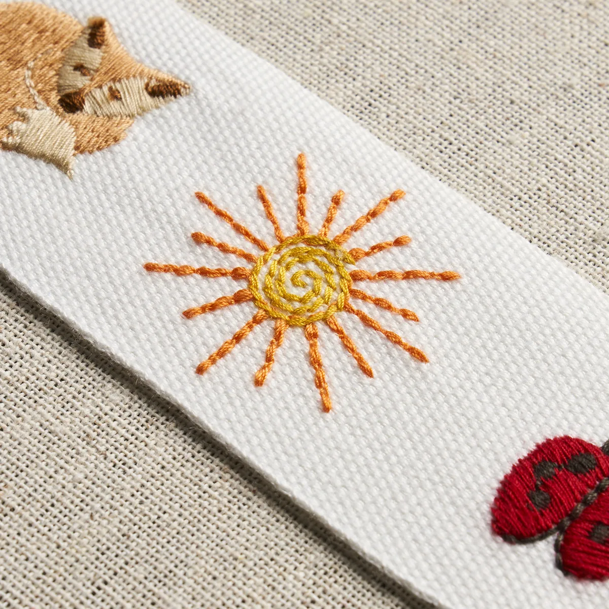 81680 | Tiny Things Embroidered Tape - Multi on Ivory Schumacher Tiny Things Embroidered Tape trim in Multi on Ivory (81680)