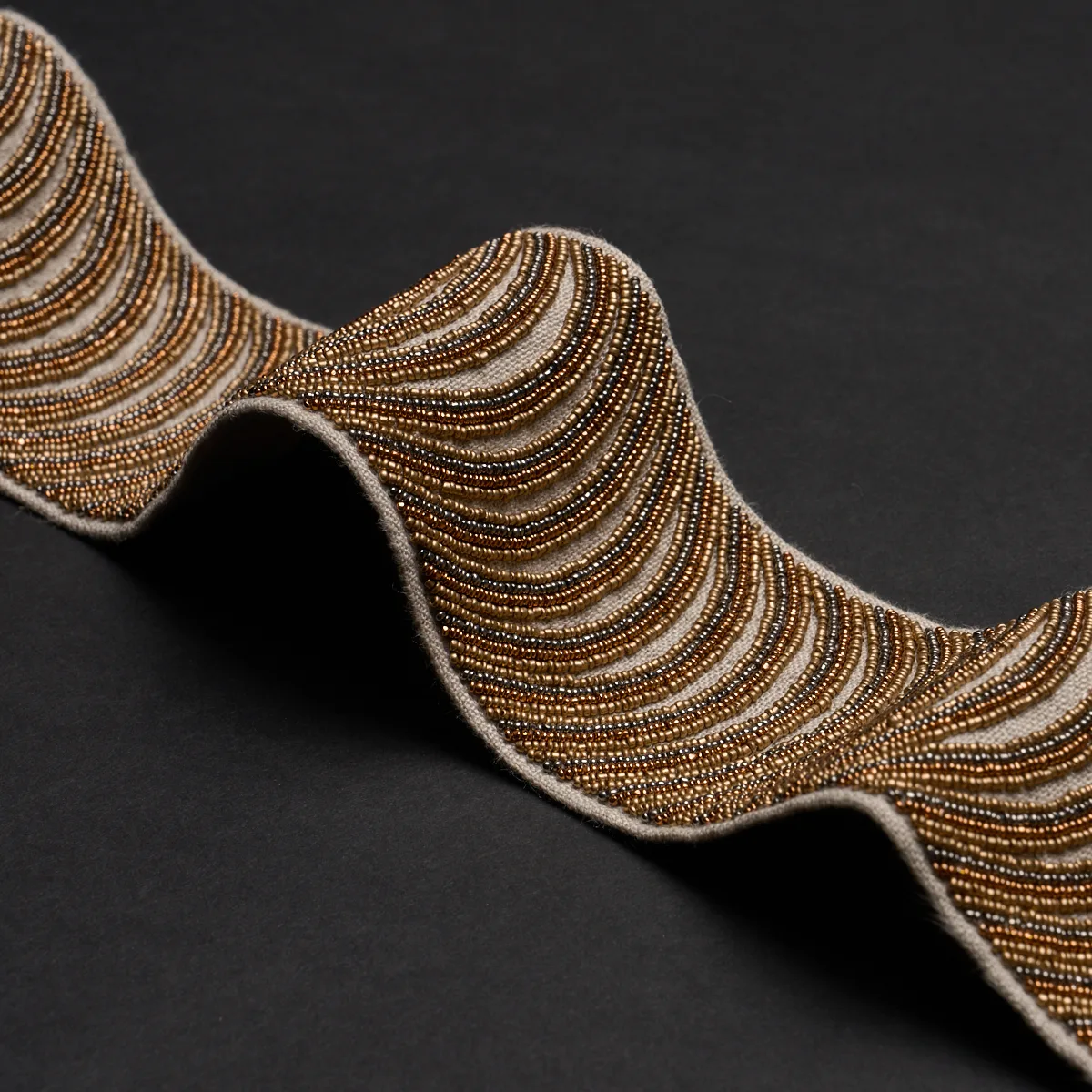 85571 | Ziegfeld Hand Beaded Tape - Gilt Schumacher Ziegfeld Hand Beaded Tape trim in Gilt (85571)